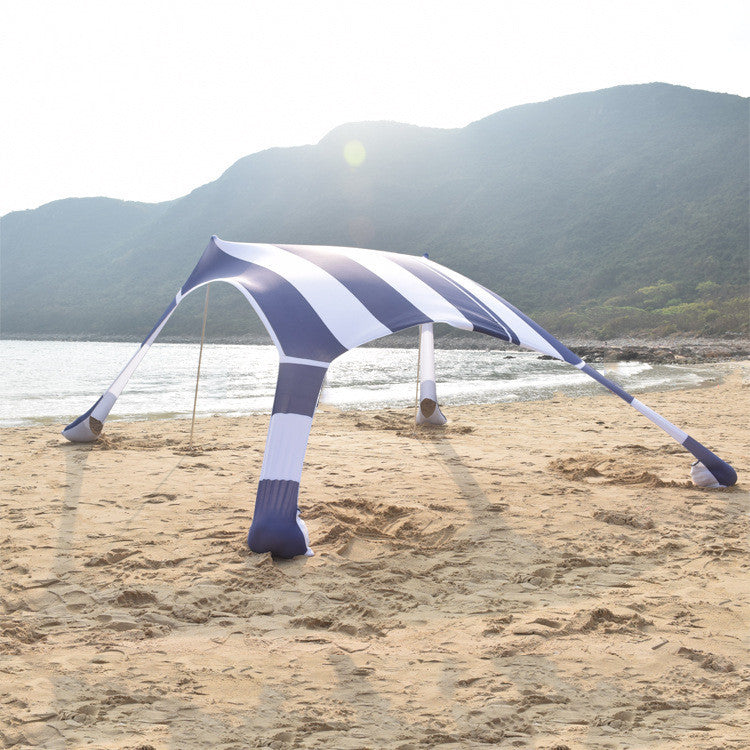 Oaken Sky Shores offers the Lycra Sky Shade Beach Tent: a lightweight, portable awning for ultimate sun protection. Easy to set up, it provides ample shade for beach days, camping, or any outdoor activity.