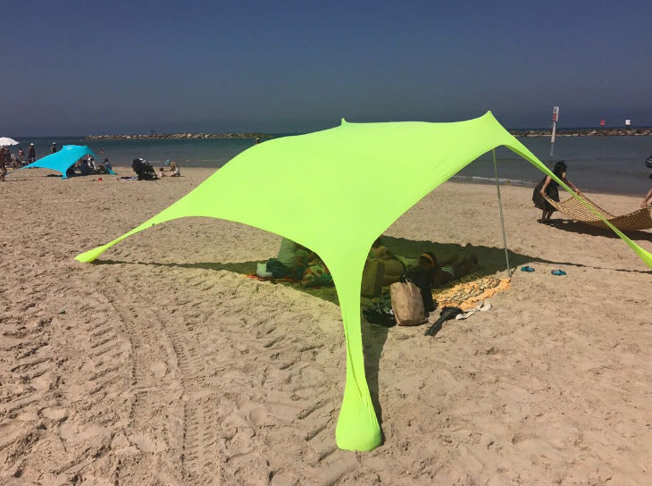 Oaken Sky Shores offers the Lycra Sky Shade Beach Tent: a lightweight, portable awning for ultimate sun protection. Easy to set up, it provides ample shade for beach days, camping, or any outdoor activity.