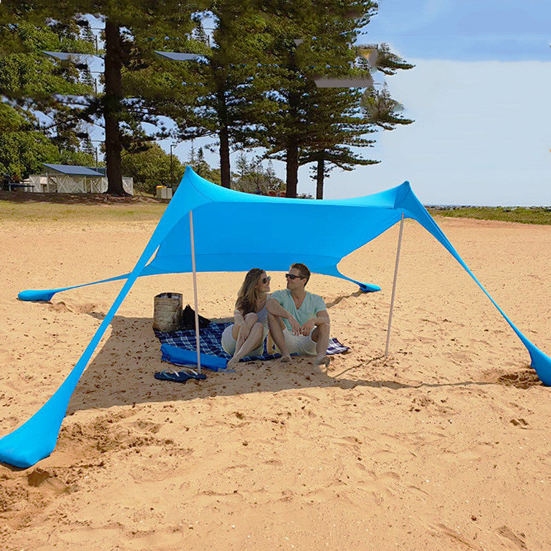 Oaken Sky Shores offers the Lycra Sky Shade Beach Tent: a lightweight, portable awning for ultimate sun protection. Easy to set up, it provides ample shade for beach days, camping, or any outdoor activity.